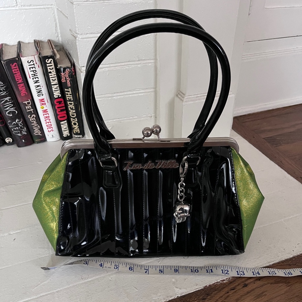 psychobilly rockabilly Lux deVille neon green and black kiss lock purse.